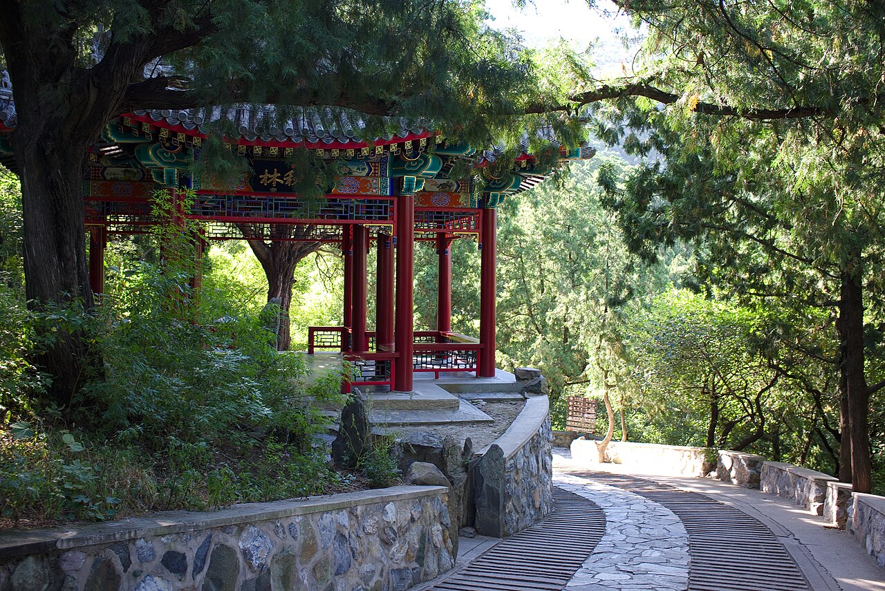 Winding shaded stone path and pavilion at Fragrant Hills Park