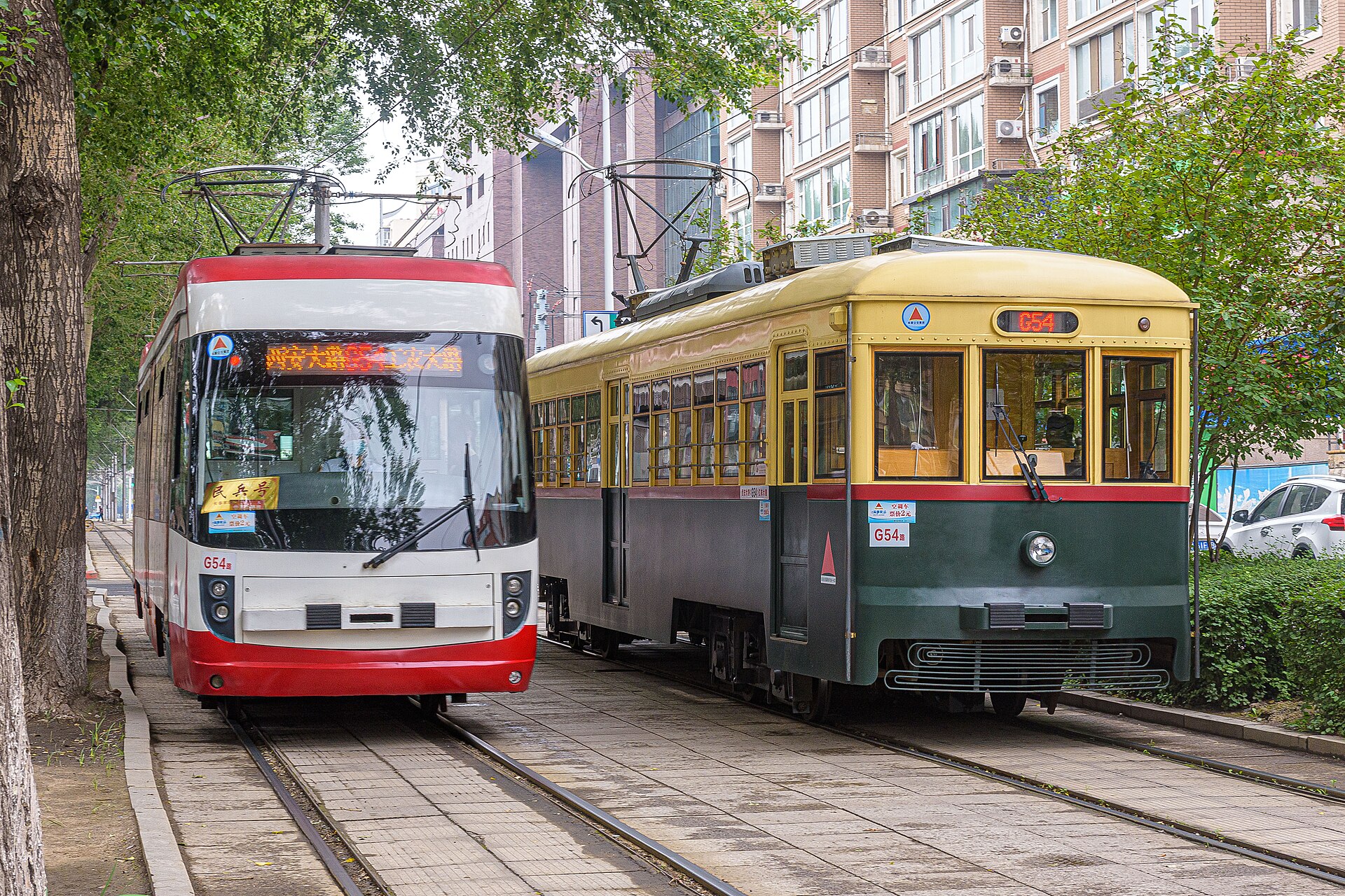 Modern and heritage-style trams passing in Changchun in 2023