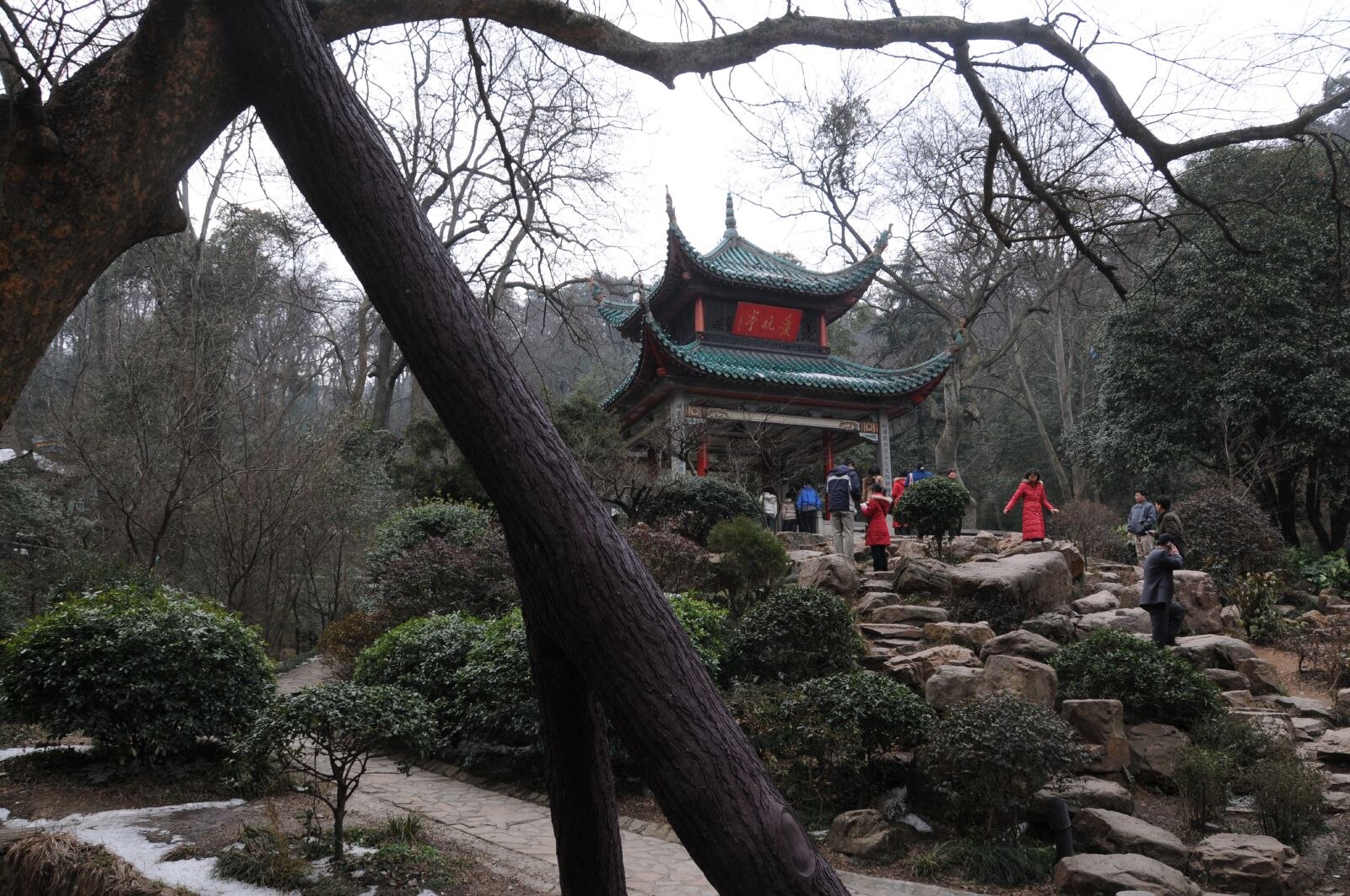 Aiwan Pavilion framed by trees and rocks