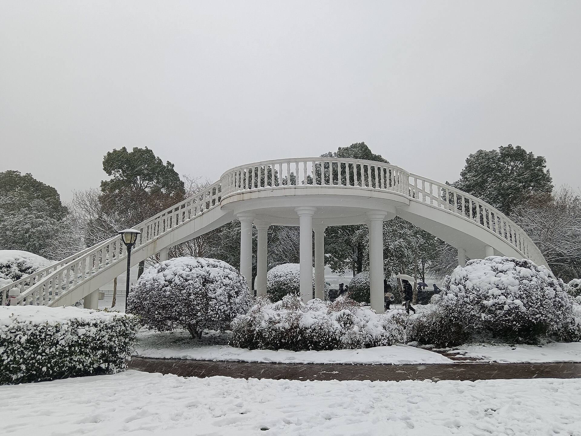 Snow-covered pedestrian bridge on Orange Isle