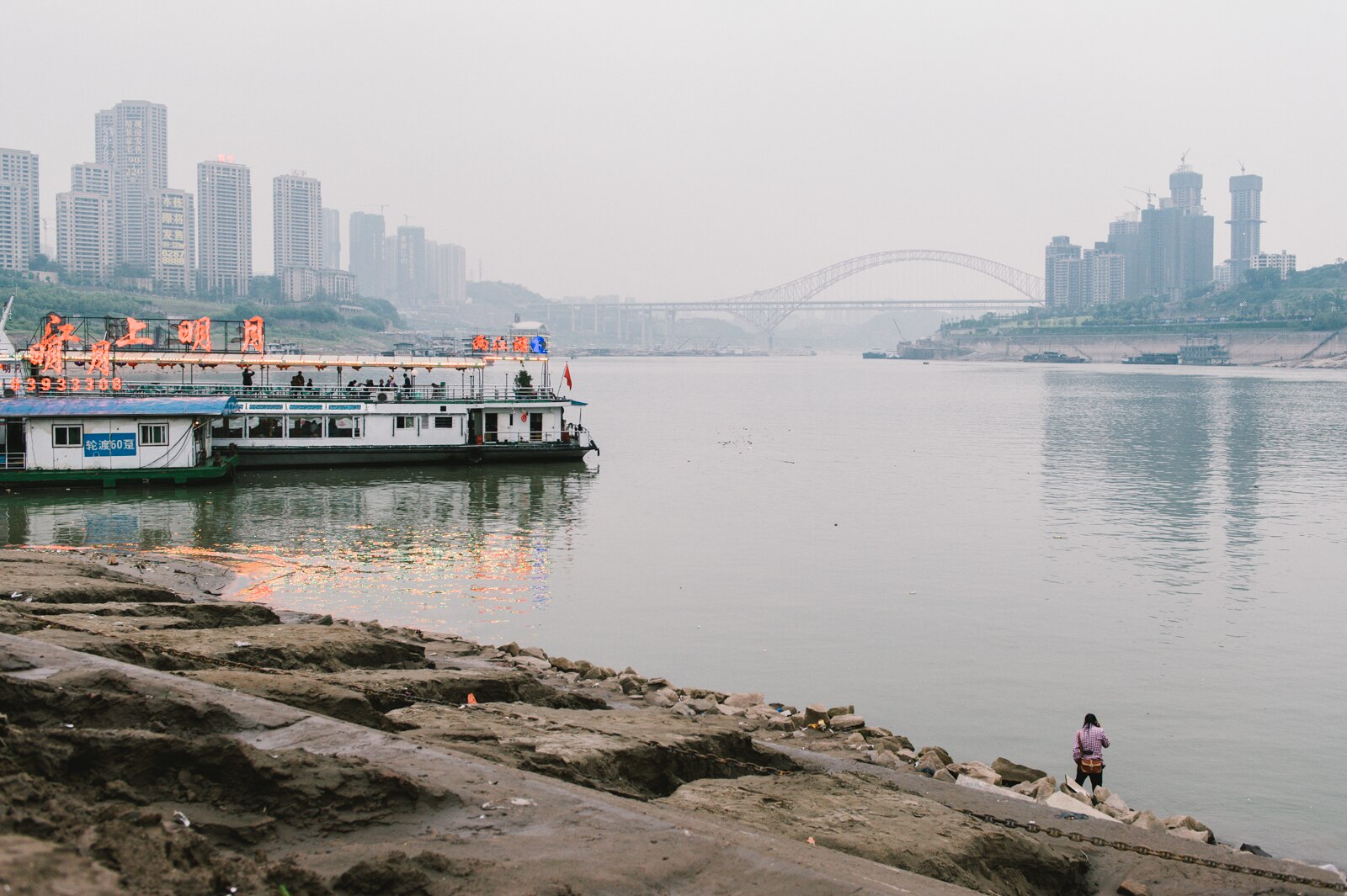 Yangtze and Jialing river junction with boats and bridge
