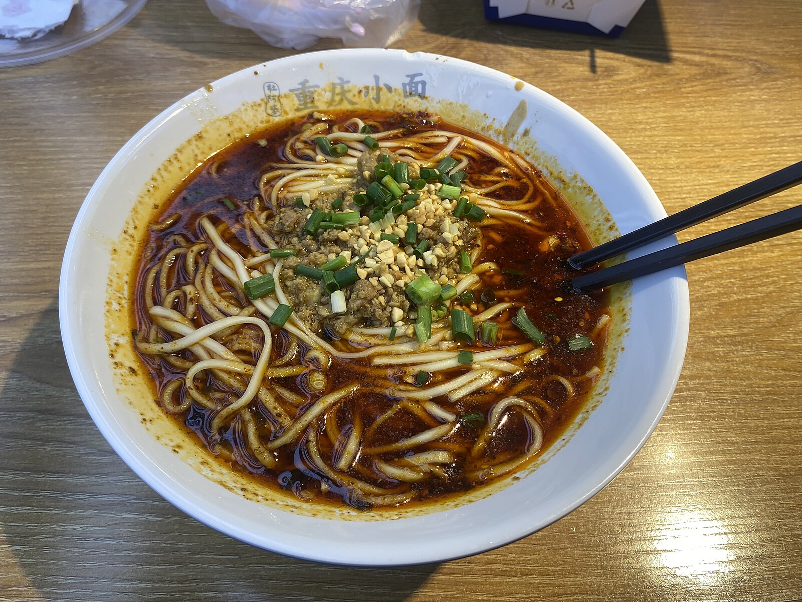 One bowl of Chongqing xiaomian with greens and peanuts