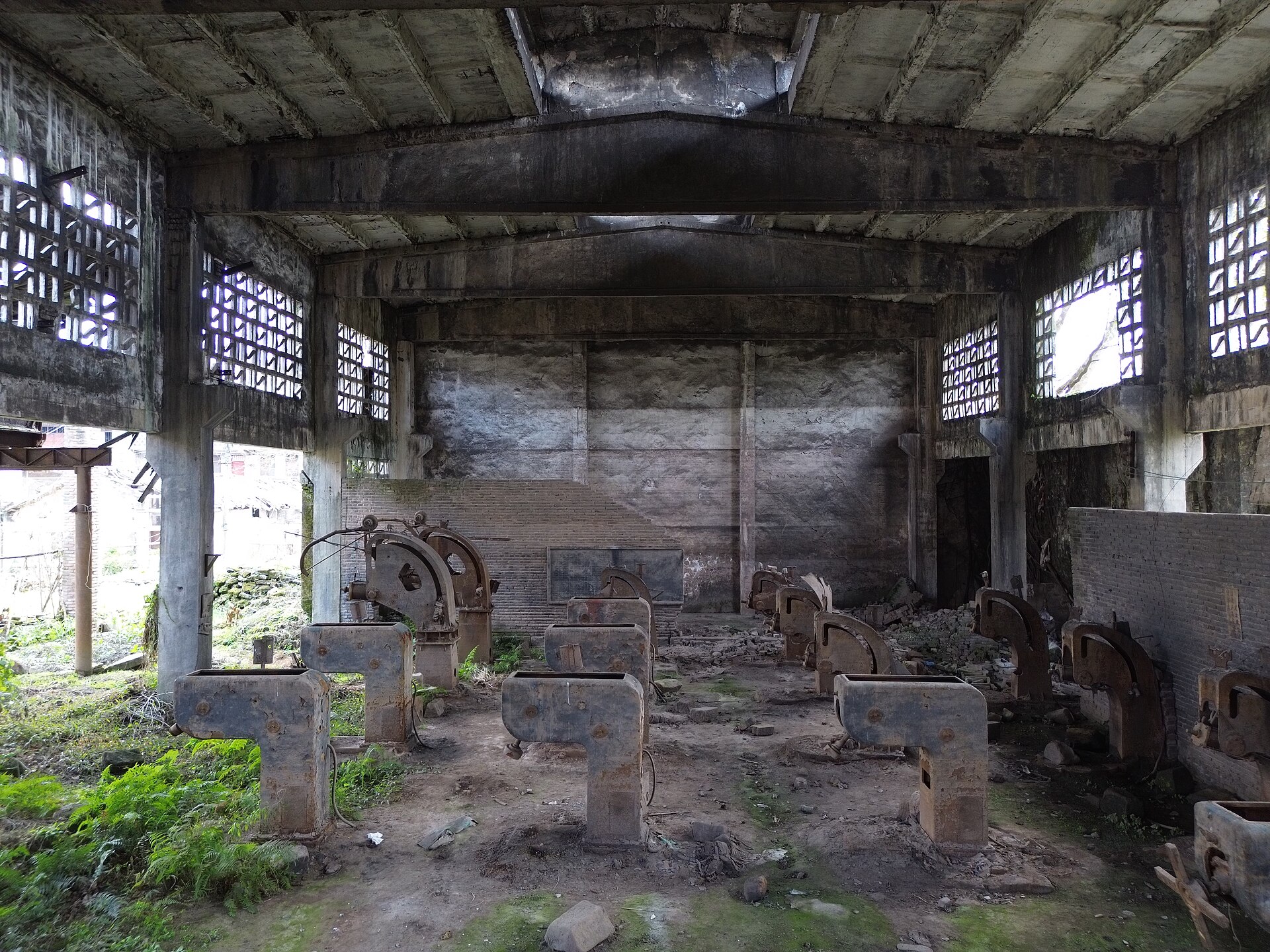 Disused concrete workshop with machine bases at Beiba in Sanhui