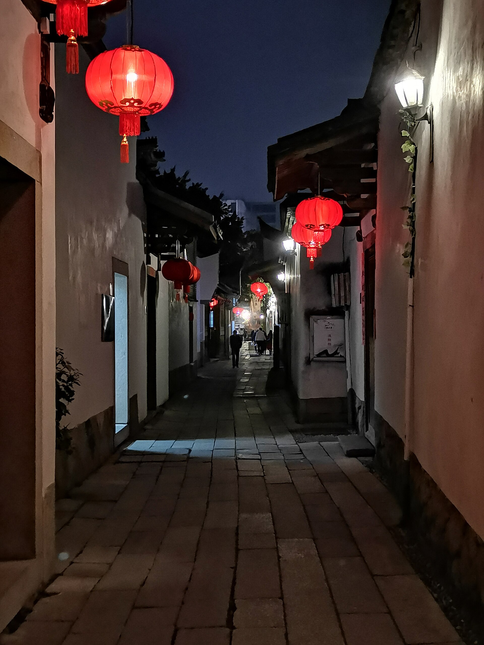 Lantern-lit lane in Three Lanes and Seven Alleys at night