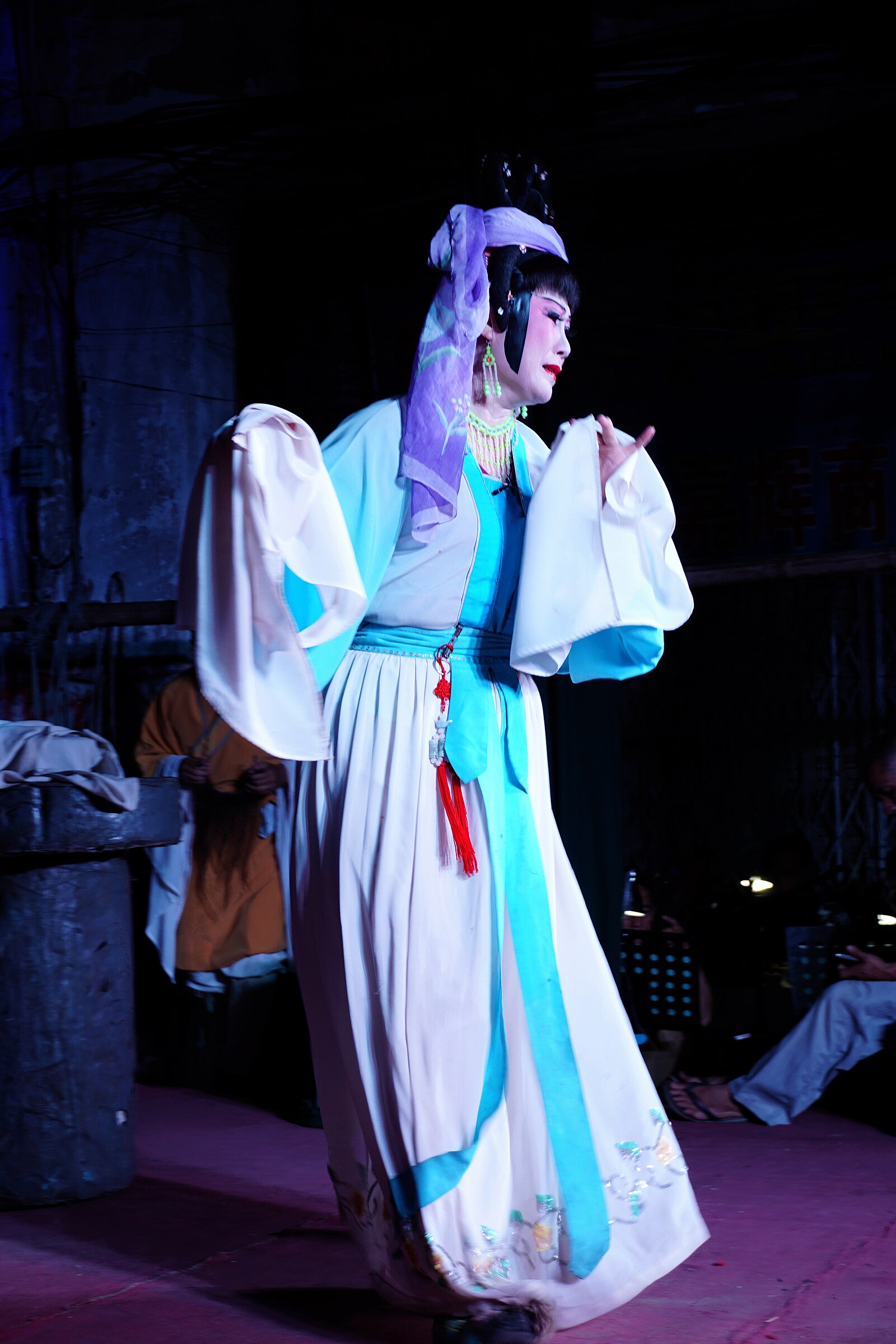 Costumed performer in a Qiong opera stage context