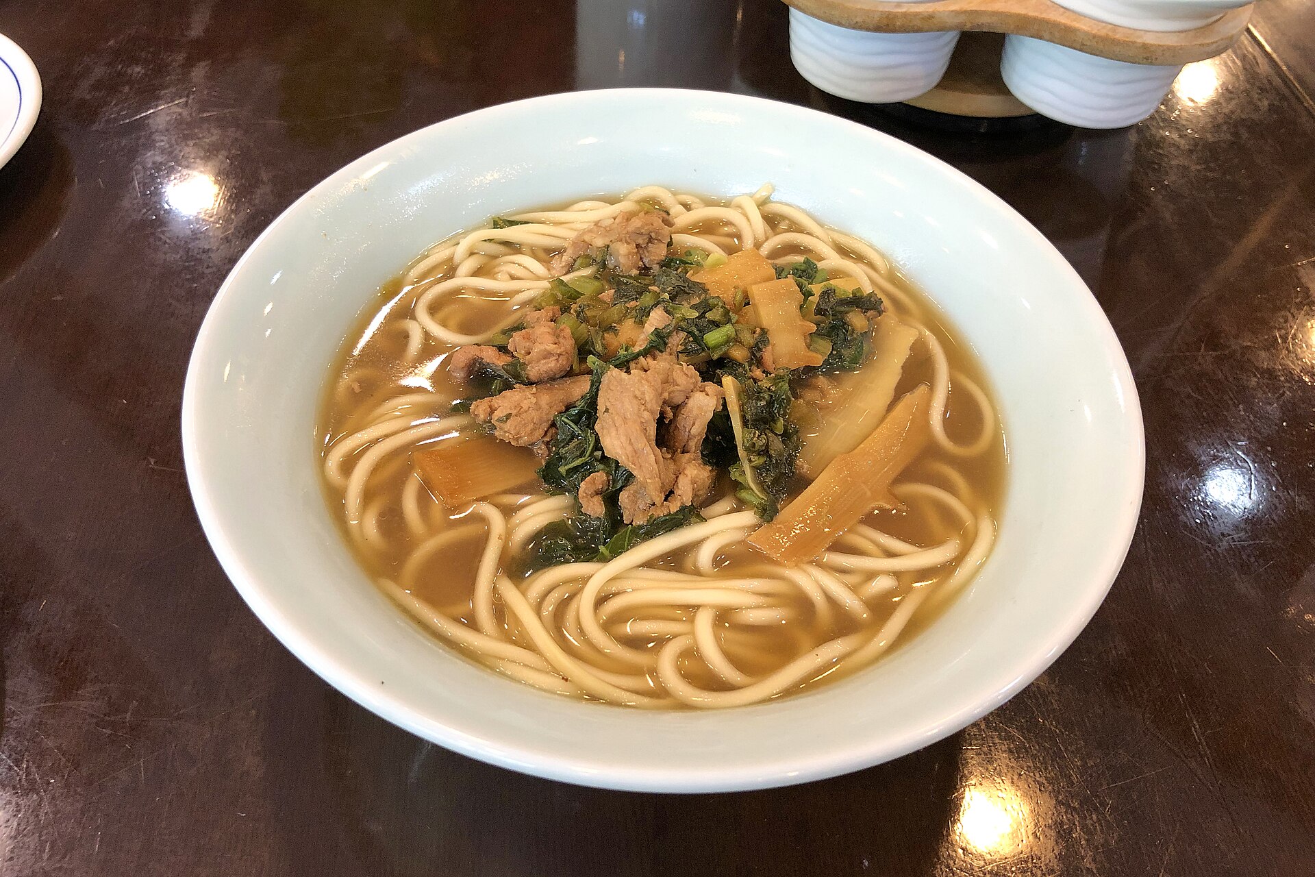 Bowl of Pian'erchuan noodles with pork, preserved greens and bamboo shoots