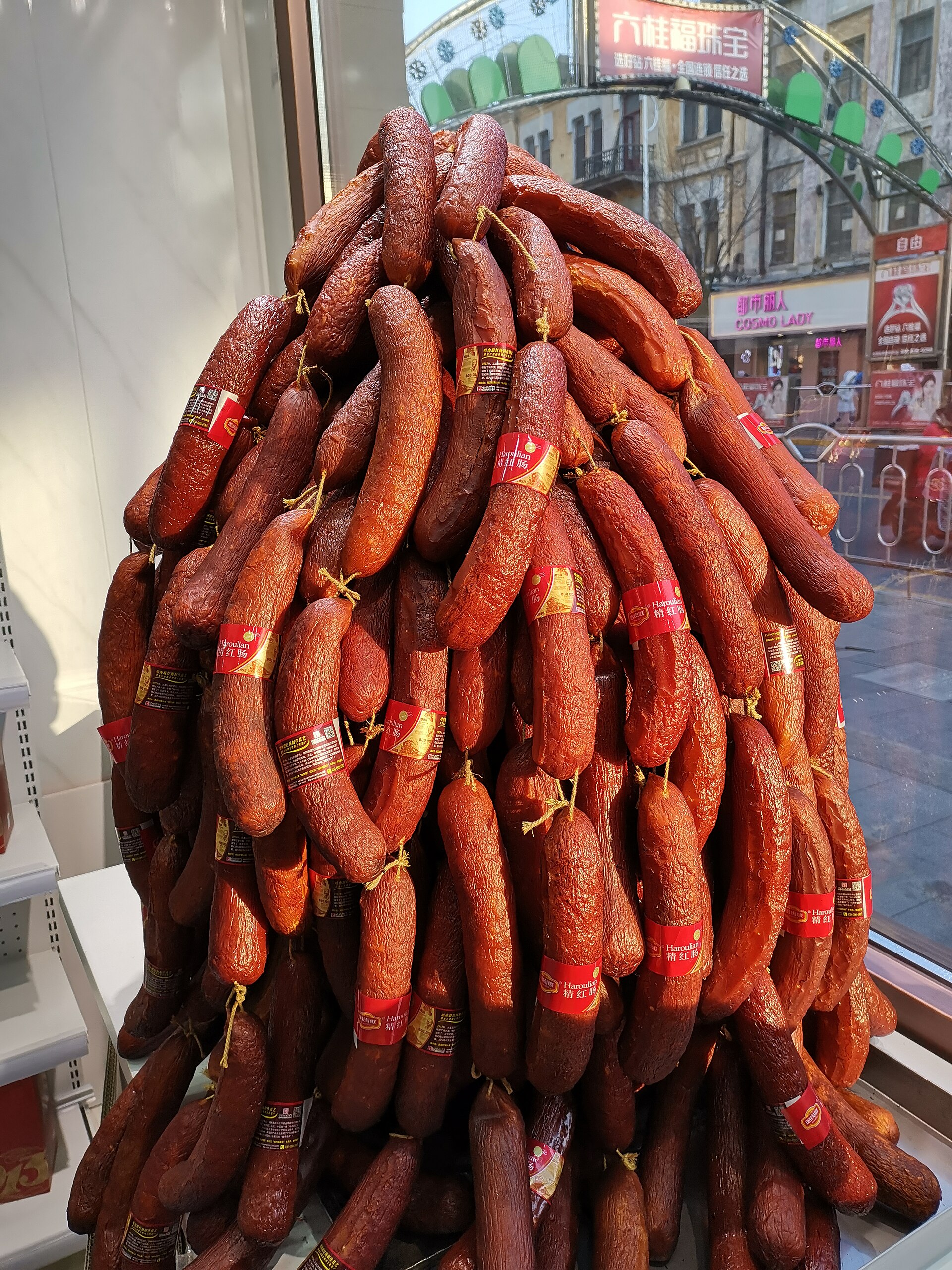 Large hanging retail display of red sausages in Harbin
