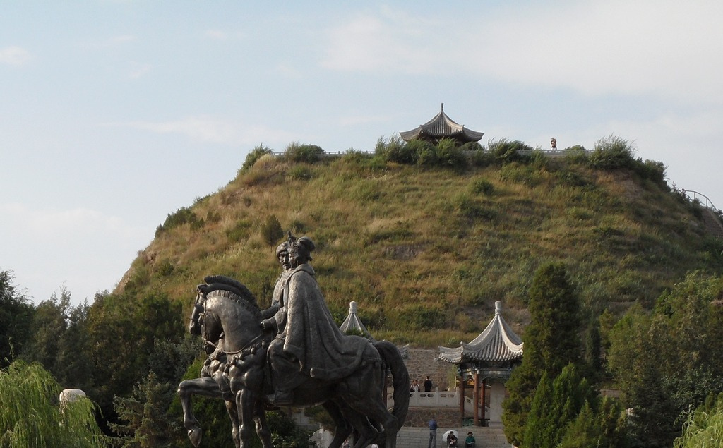Modern equestrian sculpture, mound, pavilion and visitors at Zhaojun Museum