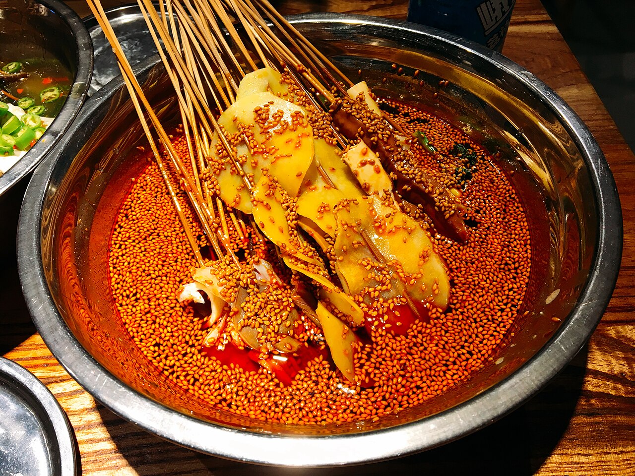 Bobo chicken skewers in red chile oil and sesame