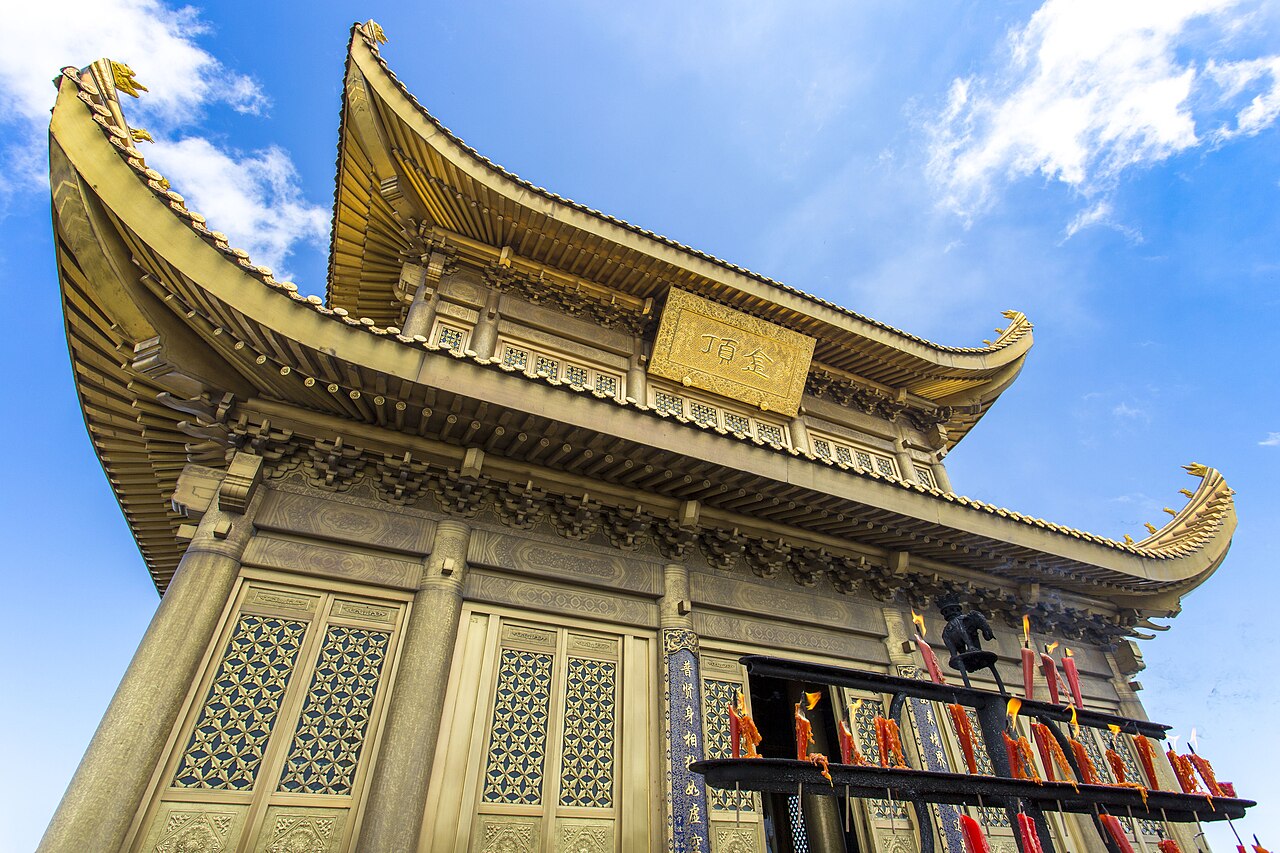 Close view of the Golden Summit building and incense stand