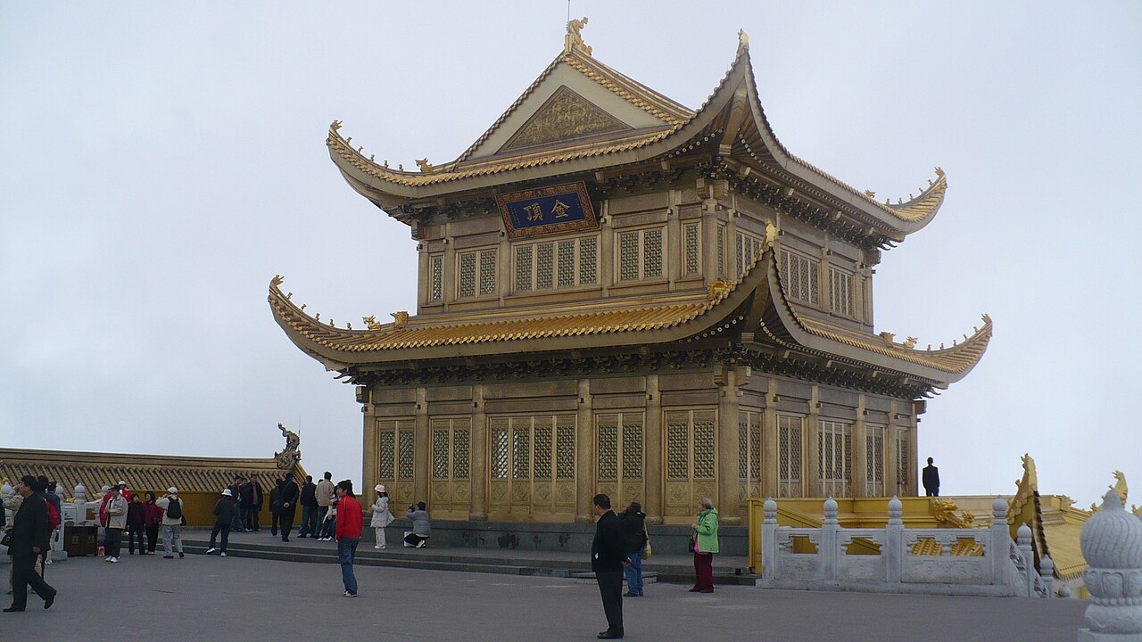 Golden Summit building on Mount Emei under a pale sky