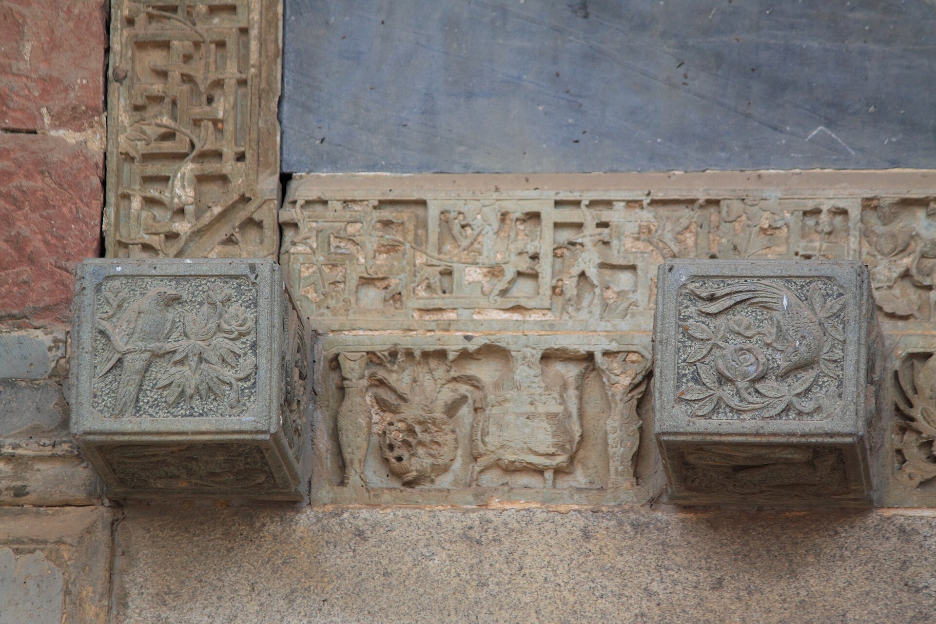Carved architectural detail at Wangshan Tuku in Xinjian District