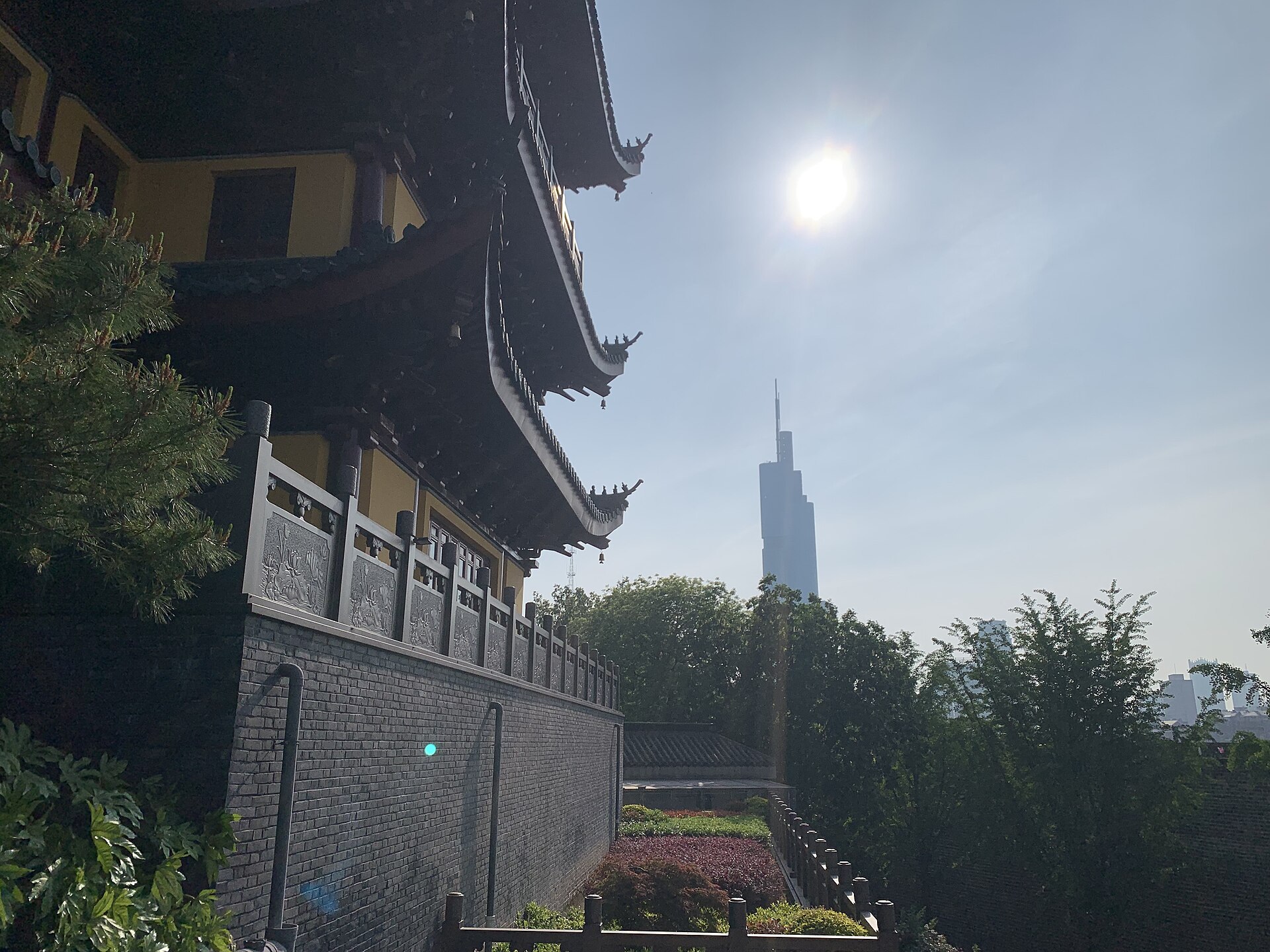 Jiming Temple buildings with contemporary towers behind in 2024