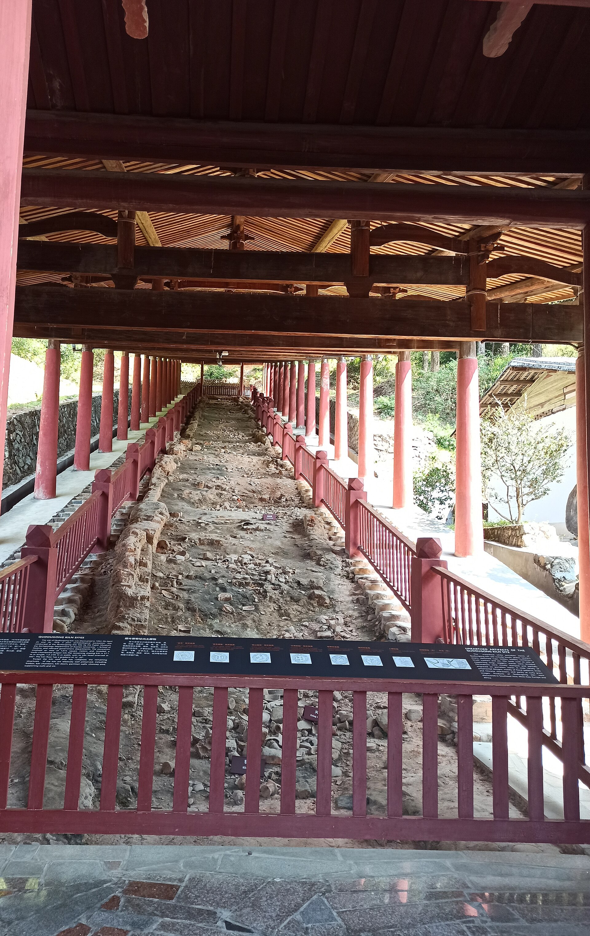 Long exposed Dehua kiln remains under a modern timber protective shelter