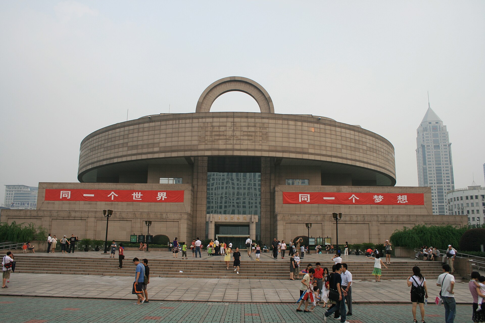 Dated frontal view of Shanghai Museum at People's Square with visitors and temporary banners