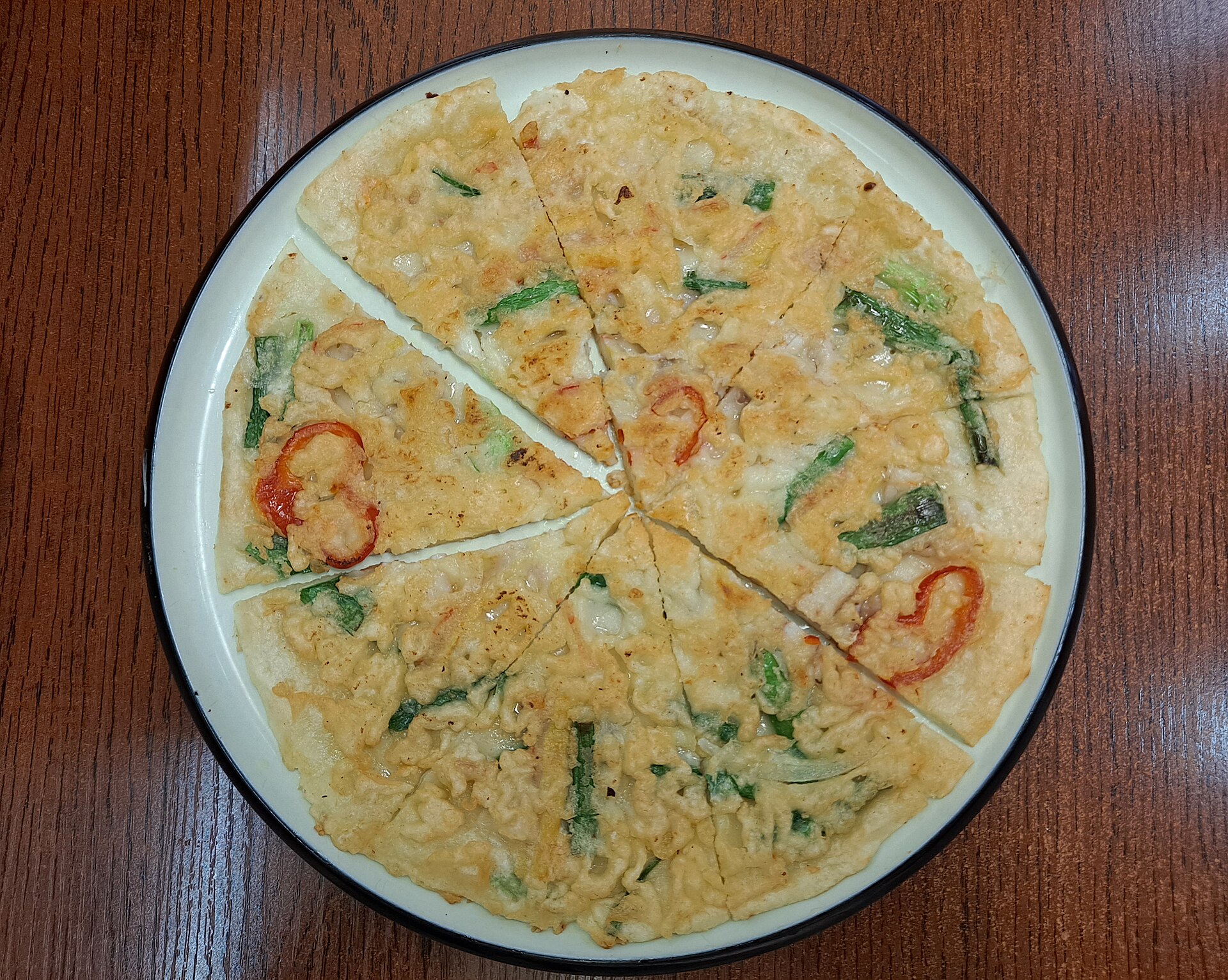 Cut seafood-and-scallion pancake served in Shenyang's Xita area