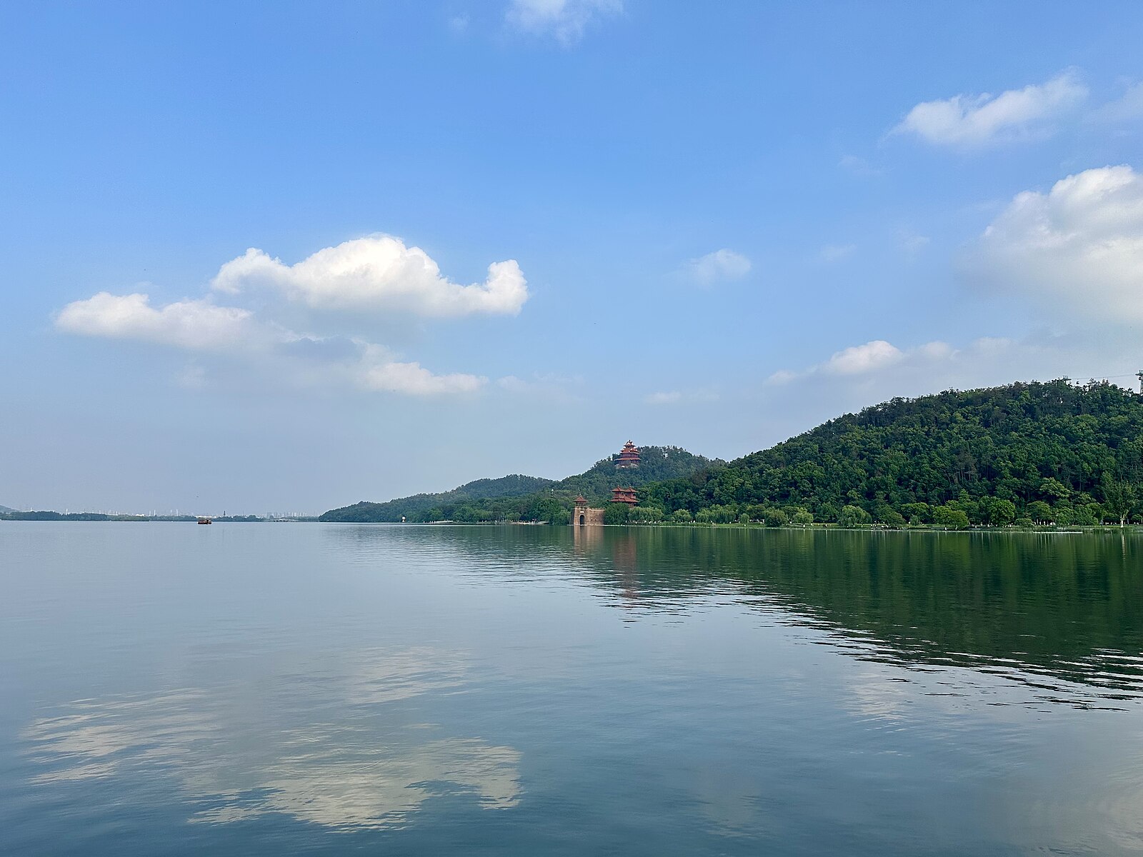 East Lake water and wooded Mount Mo under blue sky