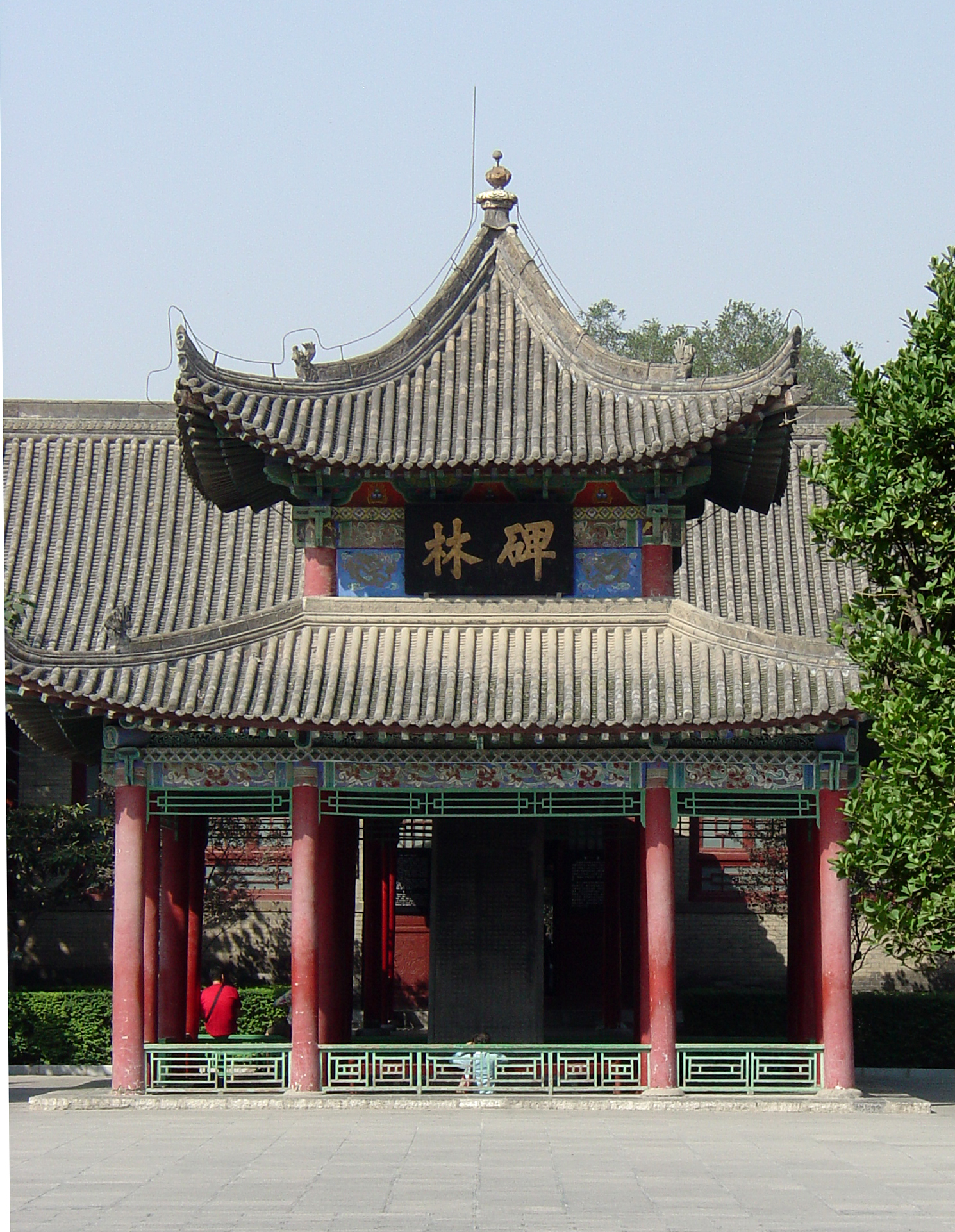 Tiled Beilin pavilion with a dark stone stele visible inside