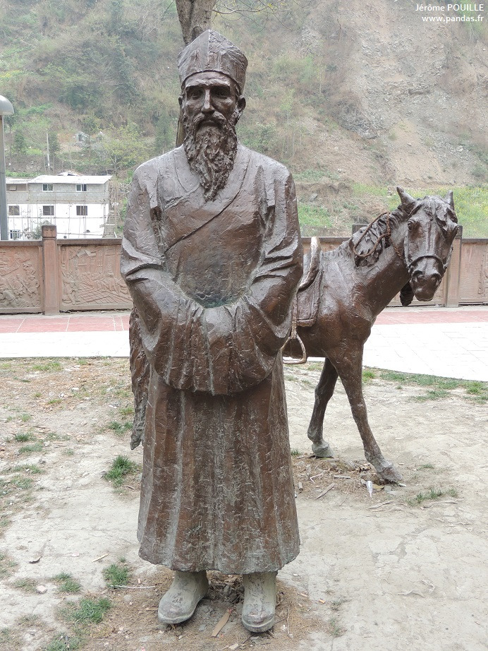 Contemporary Armand David statue used for natural-history interpretation in Baoxing