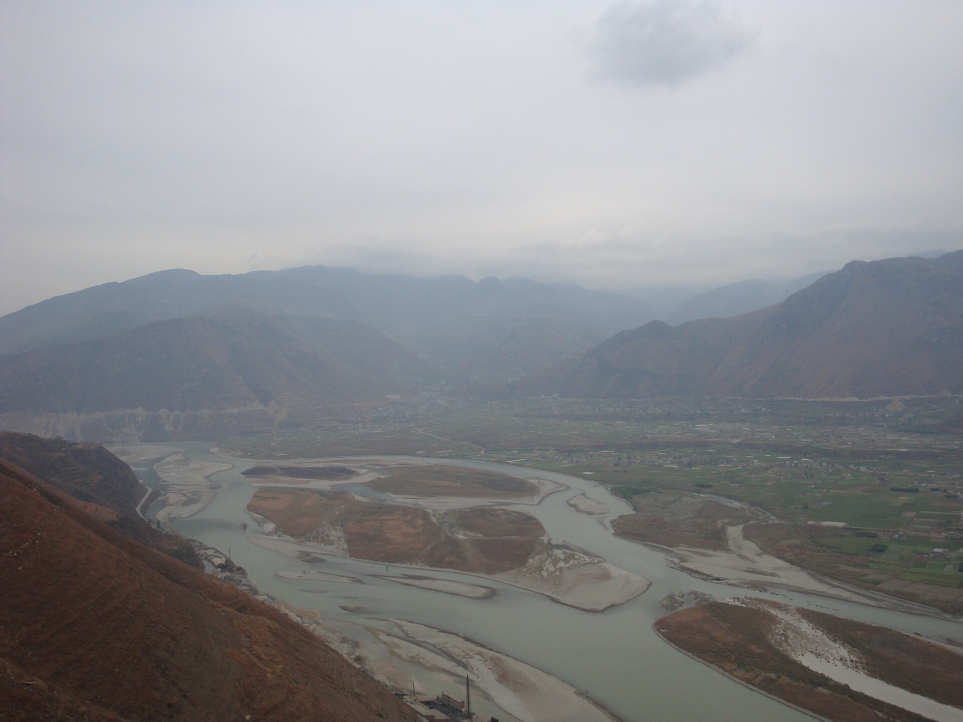 High view over braided water, fields, and settlement in Hanyuan