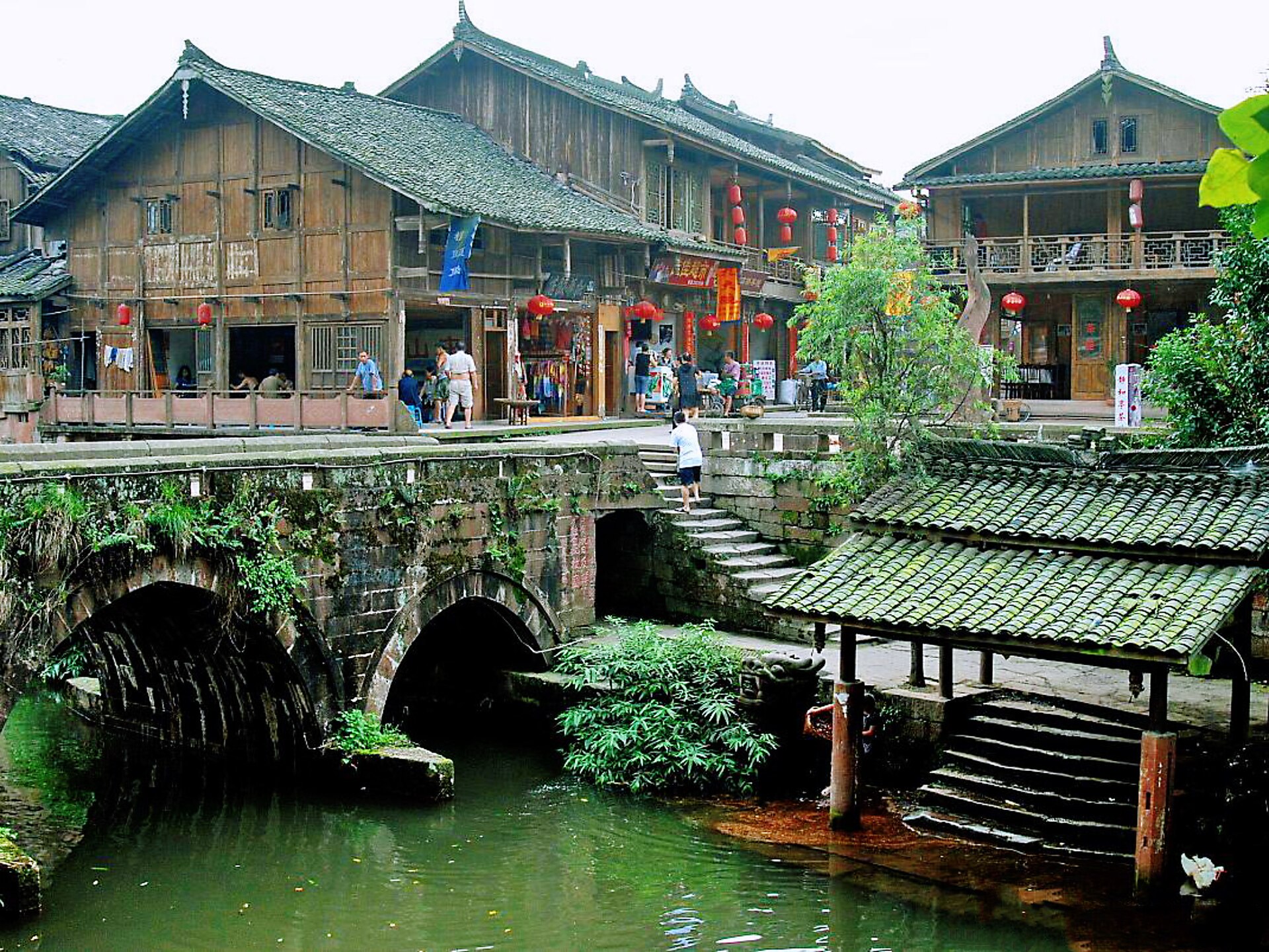 Buildings, bridge, and water edge in Shangli old town
