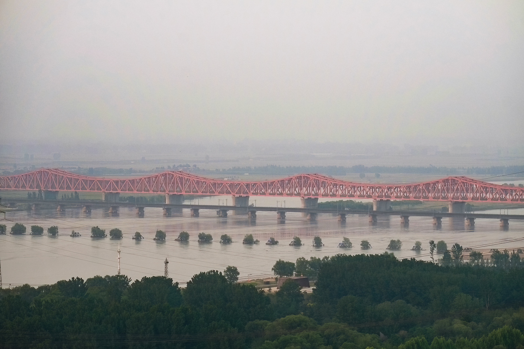 Multiple railway bridges and historic piers across the Yellow River